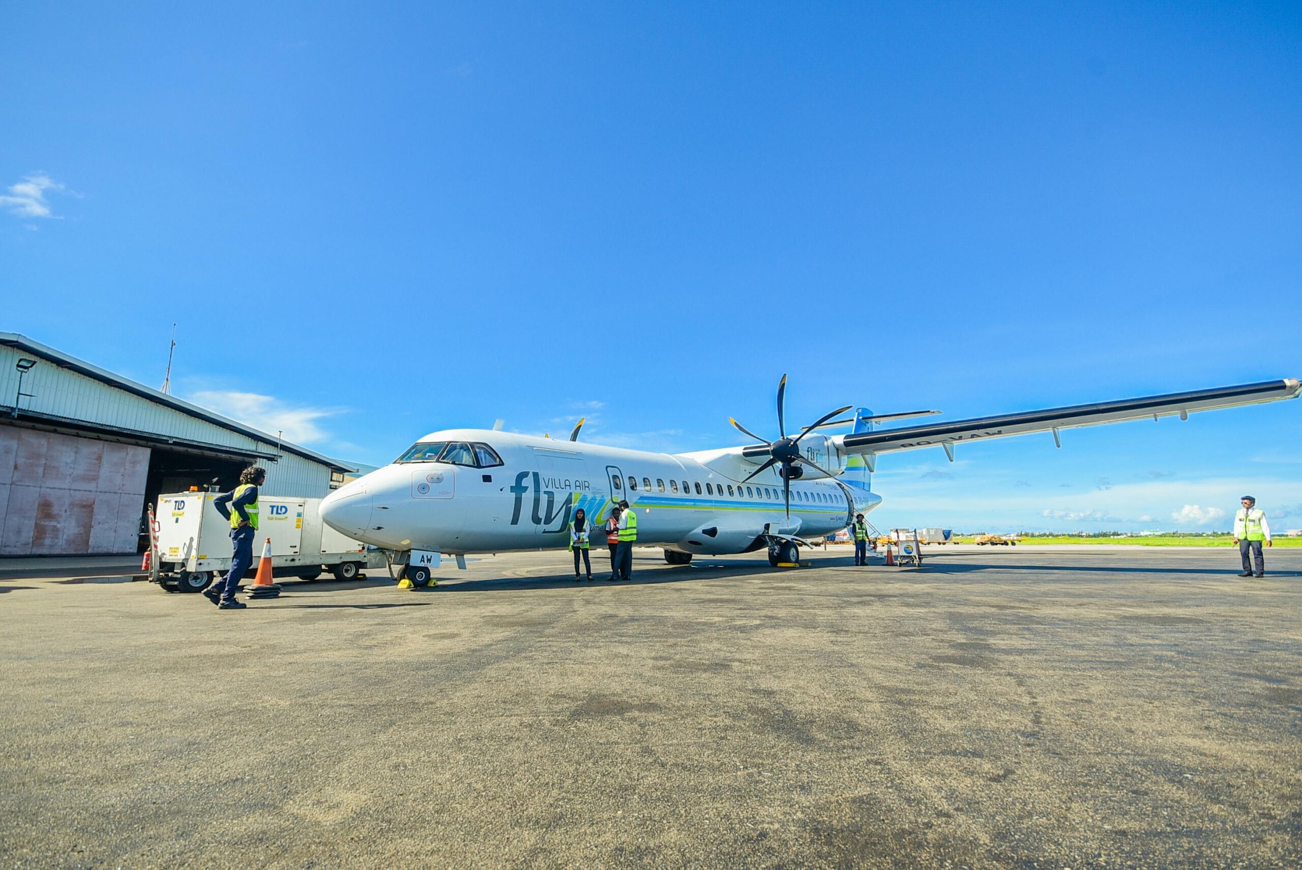 A passenger aircraft on the runway in sunny weather, ready for travel.